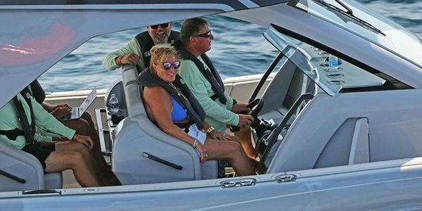 Group of people enjoying a boat ride on the water.