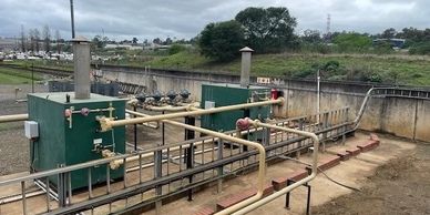 Water treatment or pumping station setup outdoors.