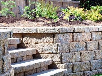 Stone retaining wall with steps