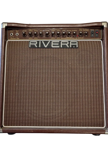 Vintage Rivera guitar amplifier with multiple control knobs and brown grille.