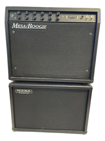 Black Mesa/Boogie guitar amplifier stack with control knobs and speaker cabinet.