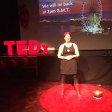 Joanna McEwen speaking at a TEDx Conference on how harmonious sound supports serendipitous moments