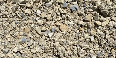 AB-3 is crushed limestone (tan or grey); an affordable option for driveway & trail development.
