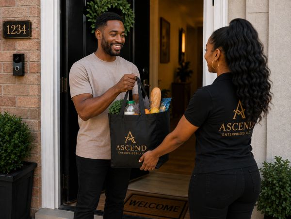 Delivery woman handing groceries to man at his doorstep.