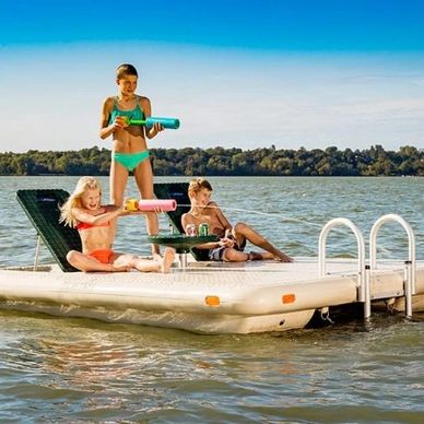 Wave Armor Swim Raft Otter Island surrounded by water with kids playing and spraying water.
