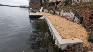 WearDeck dock and vinyl seawall installation on Long Lake in Portage Lakes, Ohio.