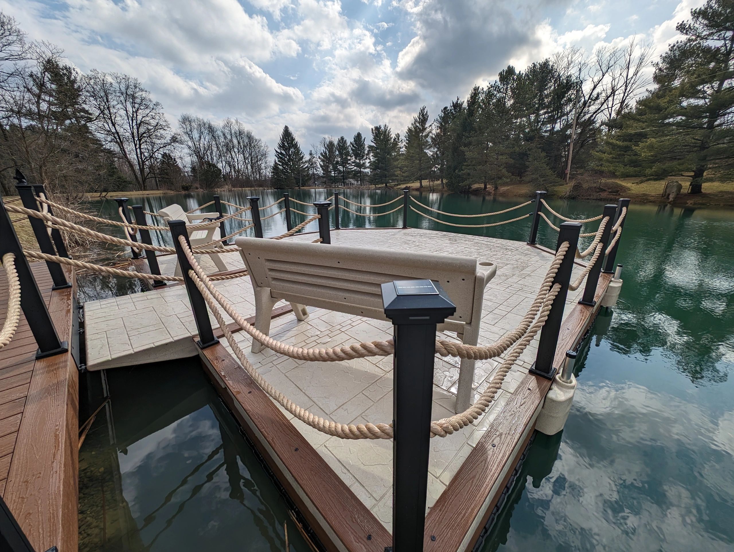 Wave Armor dock with WearDeck accents and rope railing on a private pond in Northeast Ohio