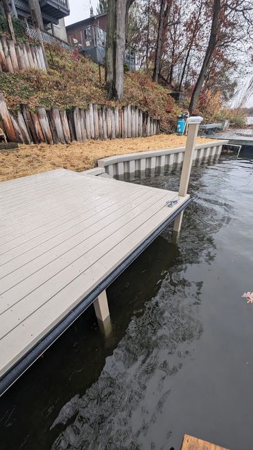 WearDeck dock and vinyl seawall protecting shoreline on Long Lake in Portage Lakes, Ohio.