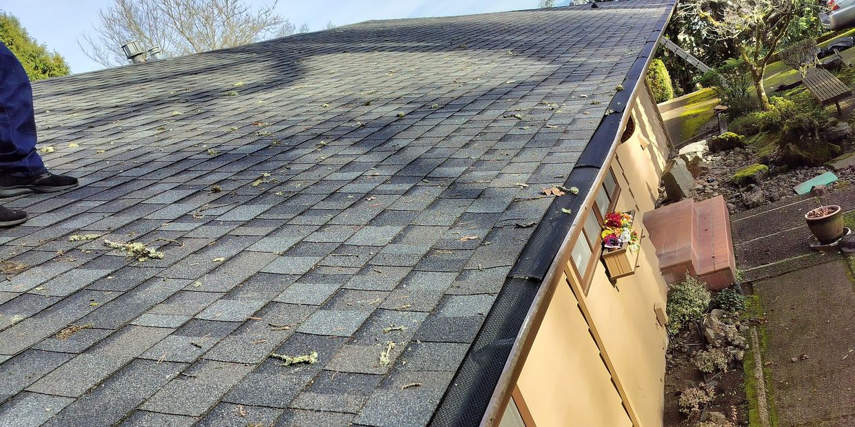 New Gutters with new gutter guards being installed in Corvallis Oregon 