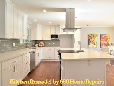 Modern kitchen with white cabinets and a large island.