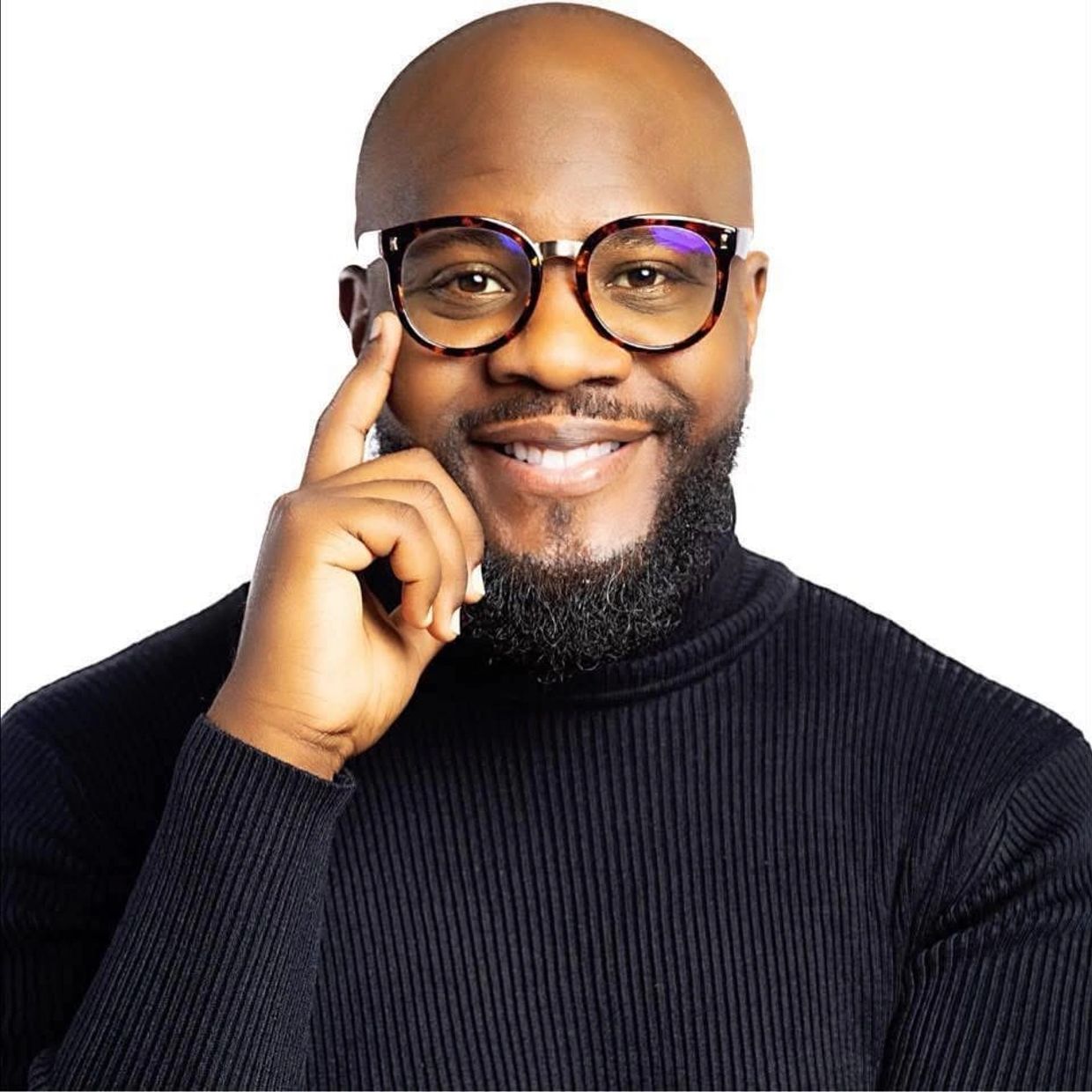 Smiling man with glasses and beard.