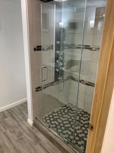 Sliding glass doors with shower panel.