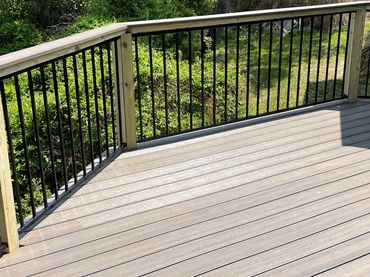Composite deck with metal railing