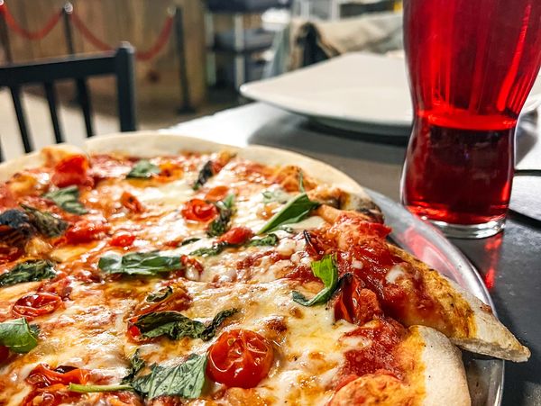 Curated guest tapped paired with a sourdough pizza