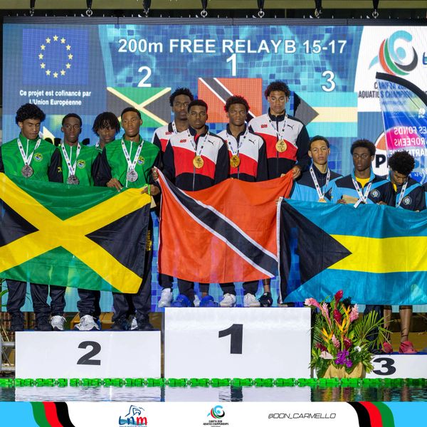 Youth relay swimming teams from Trinidad and Tobago, Jamaica, and Bahamas on the podium.