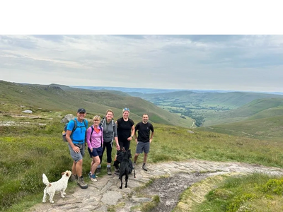 Leading a group over Kinder Scout who are training for the Three Peaks Challenge.