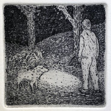 man with dog at night with flashlight