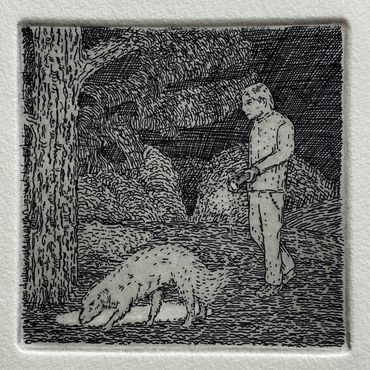 man with dog at night with flashlight