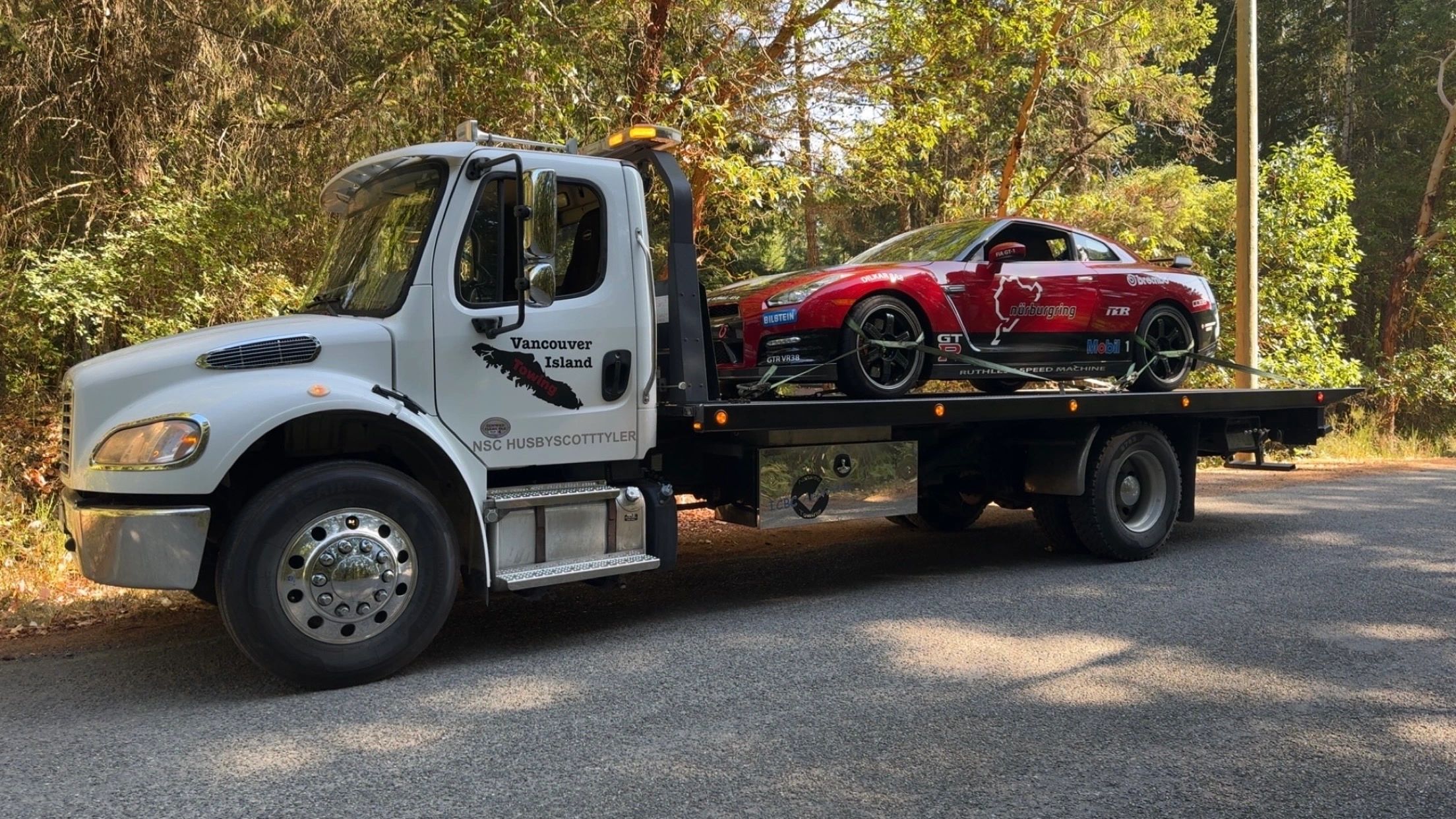Freightliner M2 Rollback tow truck, towing high end vehicle in Nanaimo b.c. 