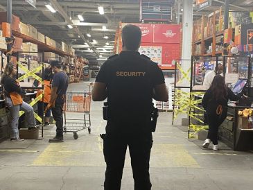 Security guard monitoring in a warehouse store.