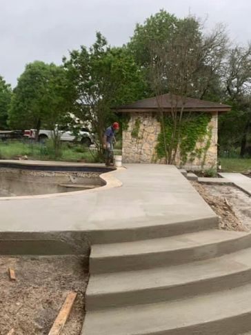 A set of steps leading to a beautiful pool deck 