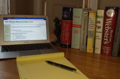 Desk with reference books and computer