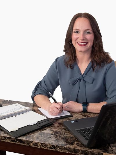 President Racquelle Pakutz at her desk