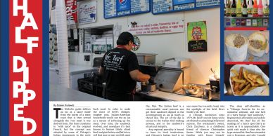 A person preparing food in a restaurant kitchen with menu boards overhead.