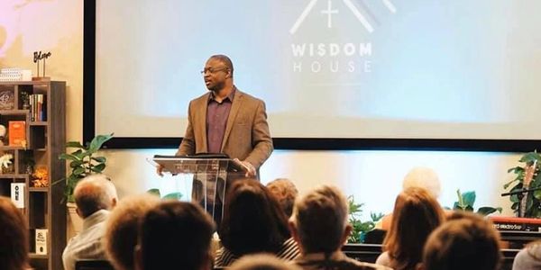 Pastor Solomon teaching at a  Worship Service.