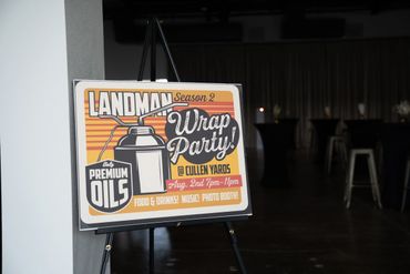 Sign for Landman Season 2 Wrap Party promoting oils and snacks.