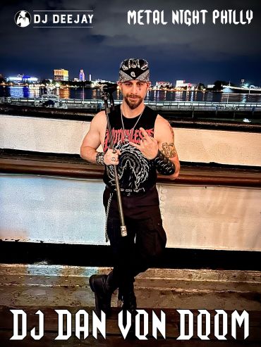 DJ Dan Von Doom posing with a microphone stand at Metal Night Philly.