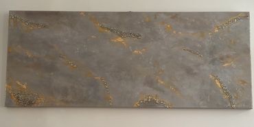 Rectangular decorative concrete slab with embedded materials.