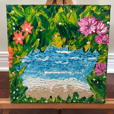 Textured painting of a beach scene framed by colorful flowers and greenery.