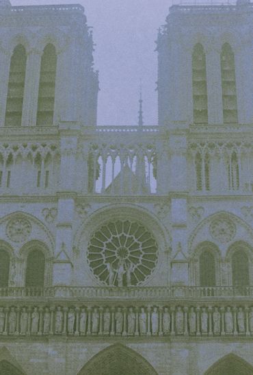 Front view of the Notre-Dame Cathedral facade with its iconic twin towers.