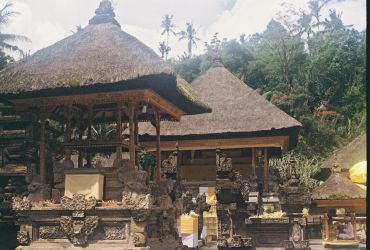 Traditional Balinese temple with thatched roofs.