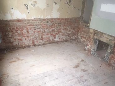 House Renovation. Waste Has Been Cleared & Floor Cleaned Apart From Close To Wall, As Wet With Glue.