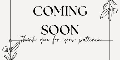Coming soon sign with floral decorations.