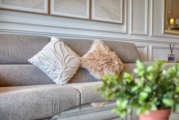 Cozy gray sofa with textured cushions in a stylish living room.