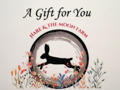 Gift card from Hare &amp; The Moon Farm with a floral design and a leaping hare.