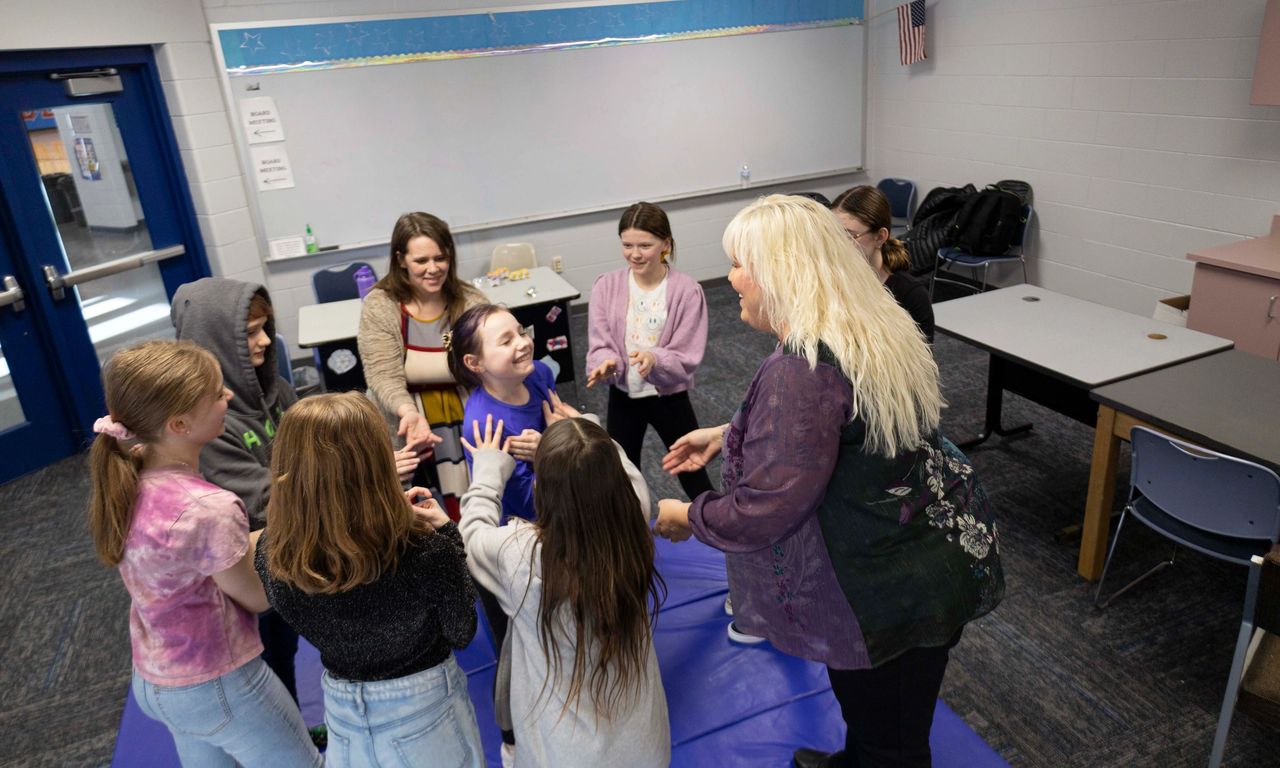 Students from Dollar Bay-Tamarack City TOP Club participate in a trust-building exercise during their weekly TOP Club meeting. 