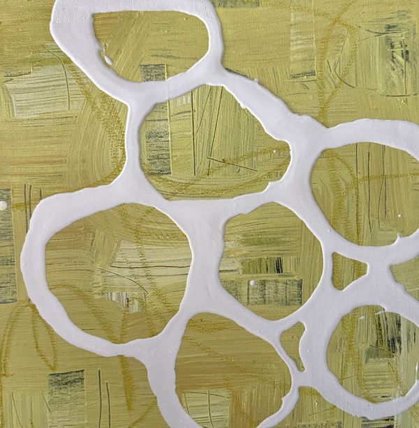 Abstract yellow textured background with white interconnected circular shapes.