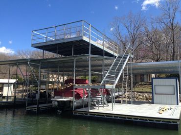 Image 2 of 3 of dock under construction. Now includes a 2nd level, stairs, lift, & bar/storage shed.