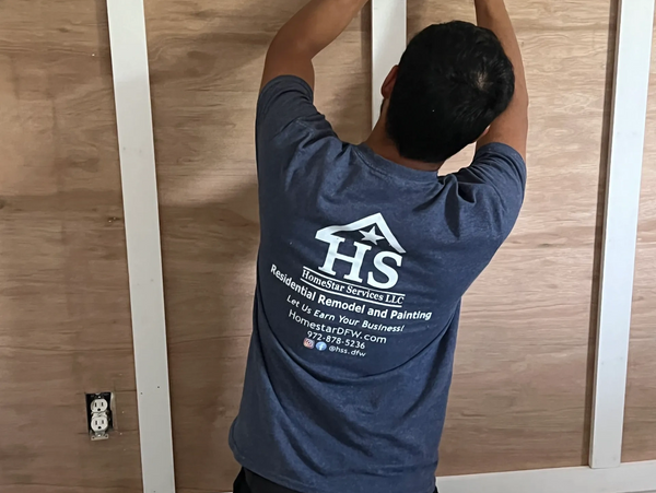 Employee doing prep work on walls