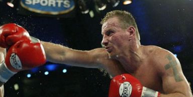 a man punching another person 