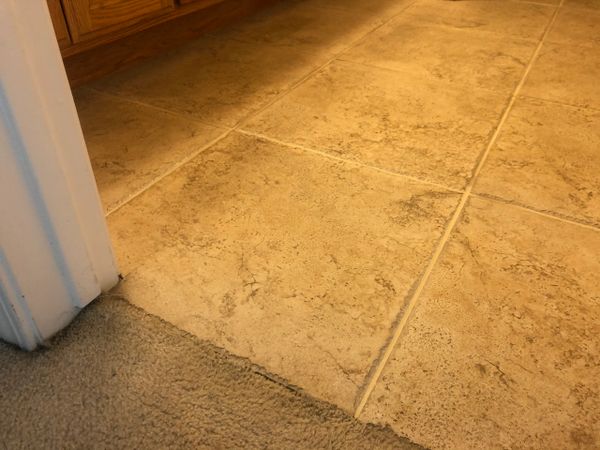 A broken tile was found after a inspection. A new matching tile was installed and grouted to match f