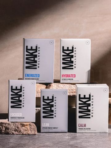 Five MAKE Wellness supplement boxes for different health goals on stone blocks.