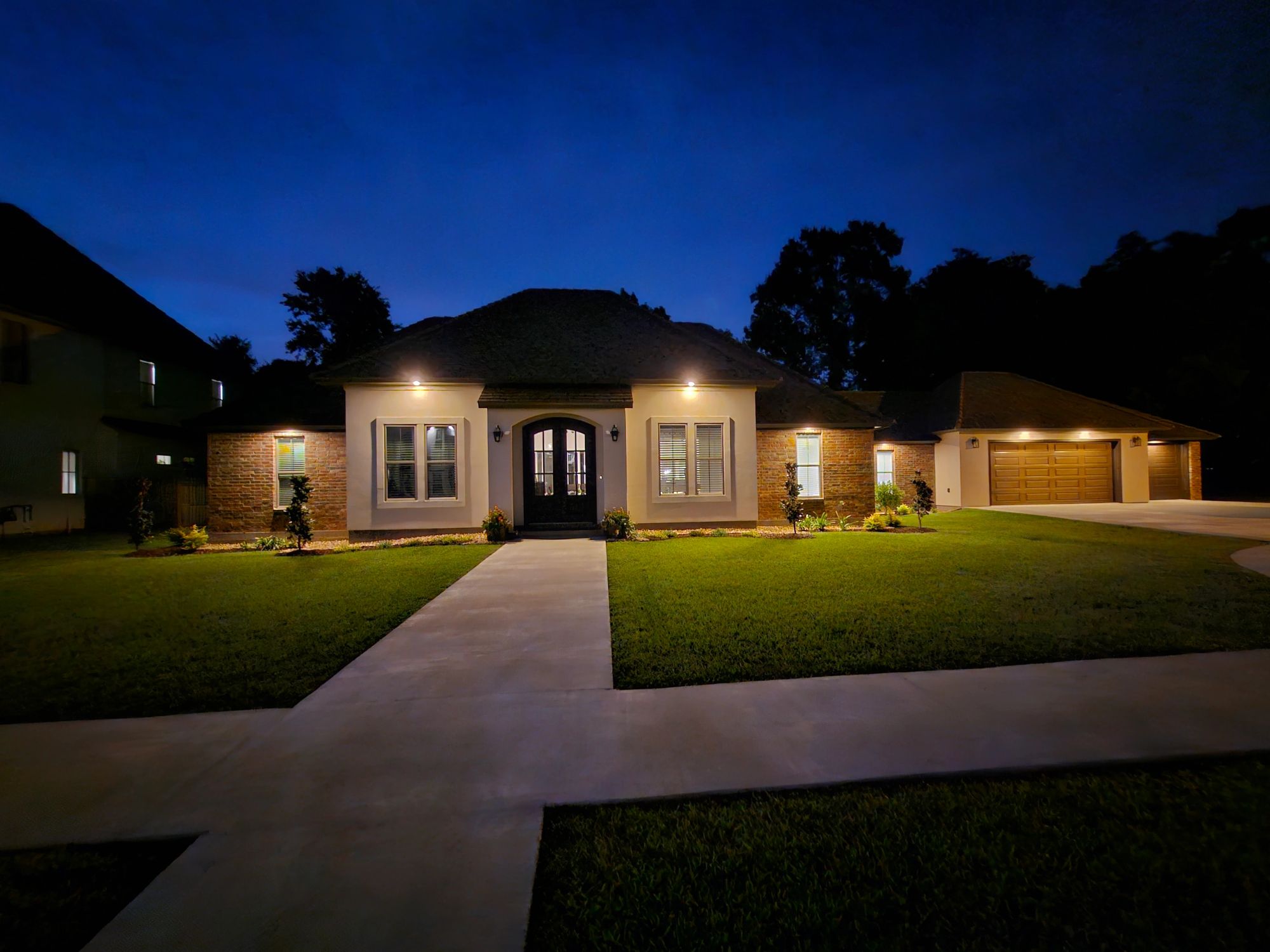 Custom home at dusk built by Rybard Homes