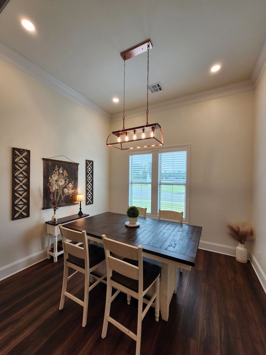 Dining room with linear chandelier