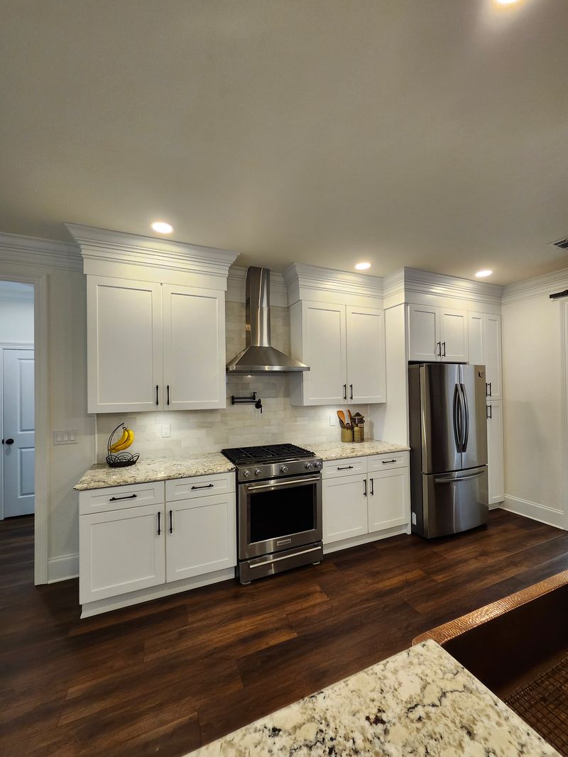 Finished white kitchen with stainless appliances