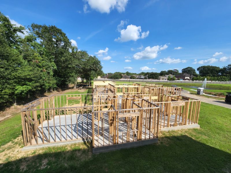 Framing and roof trusses going up on a custom home
